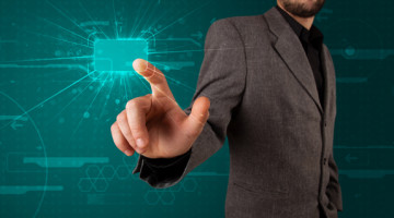 Businessman pressing high tech type of modern buttons